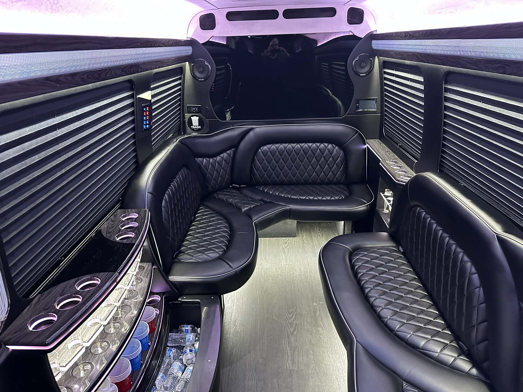 Interior of a luxury Sprinter limo with premium seating and amenities in Dallas–Fort Worth