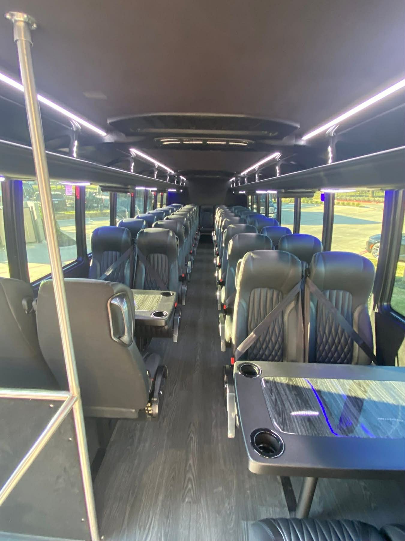 Interior of a 44-passenger executive motor coach with luxury seating in Dallas–Fort Worth