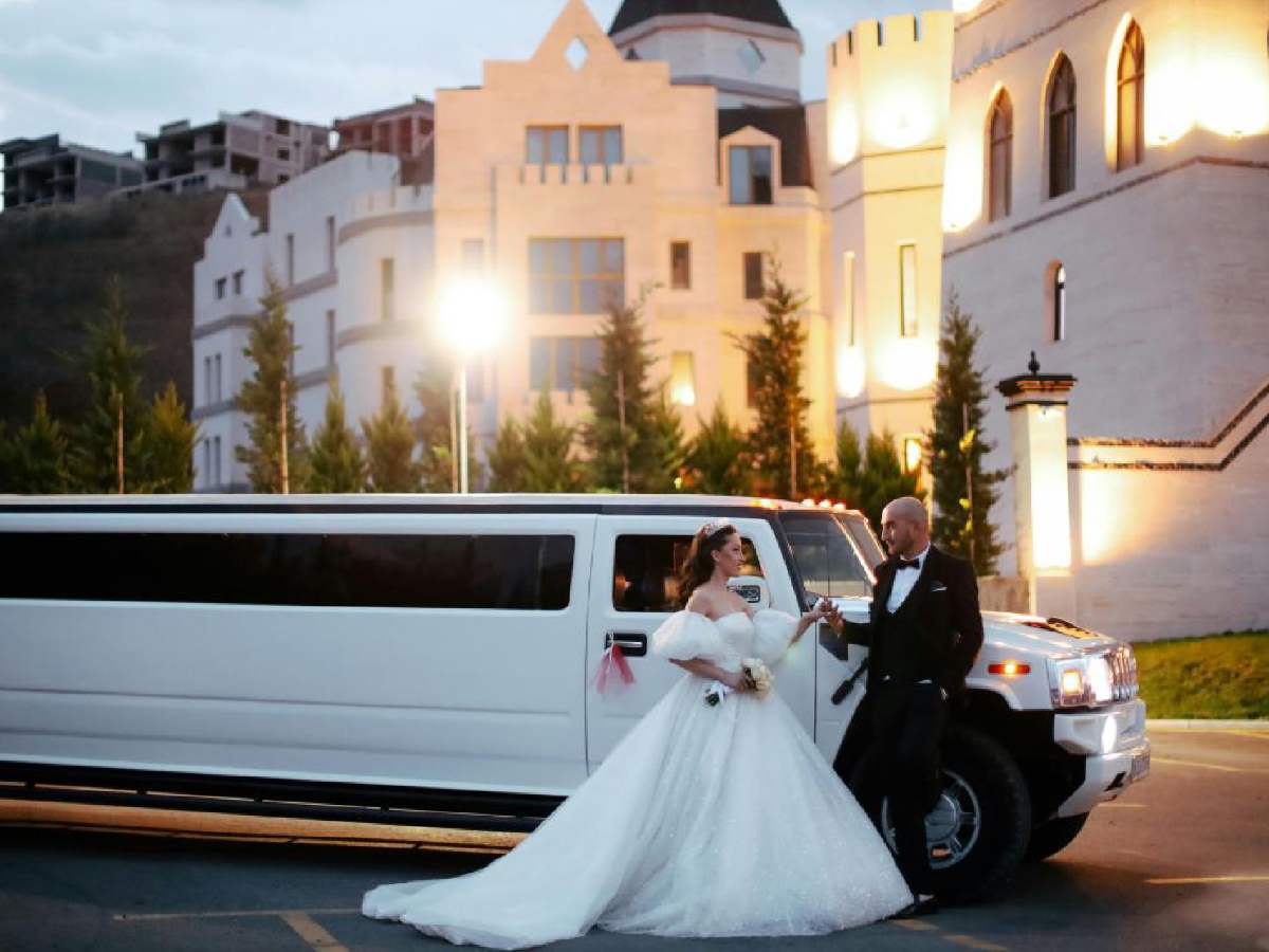 Luxury wedding limousine with bride and groom in Dallas