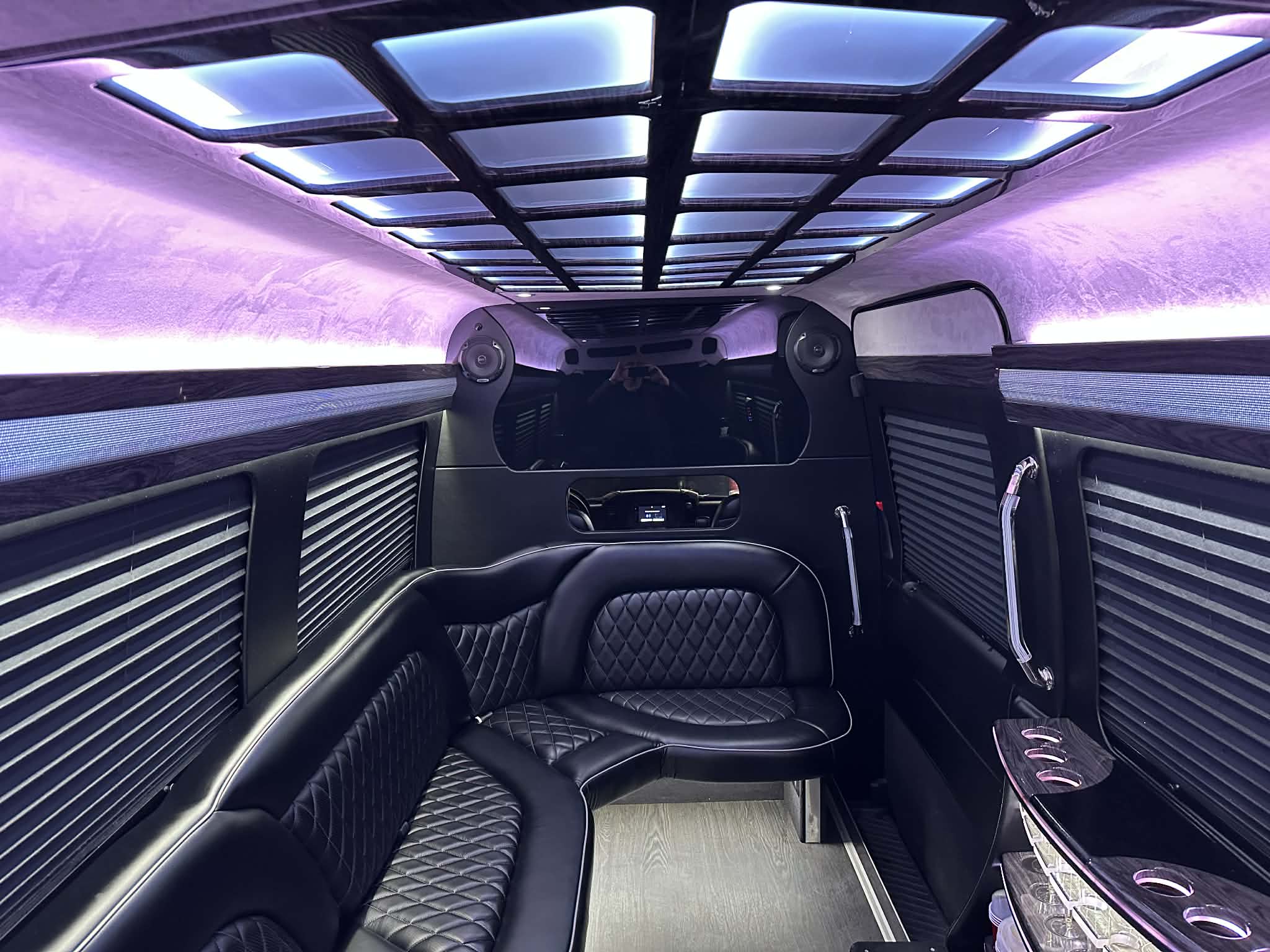 Interior of a luxury Sprinter limo with party features for group transportation in Dallas–Fort Worth